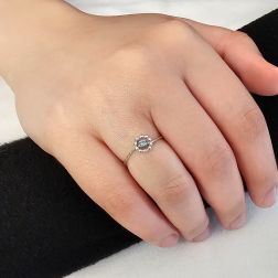 Photo of worn Easy Flower Blue Diamond White Gold Solitaire Ring