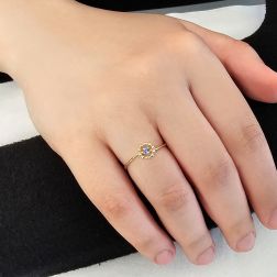 Photo of worn Easy Flower Blue Sapphire Yellow Gold Solitaire Ring