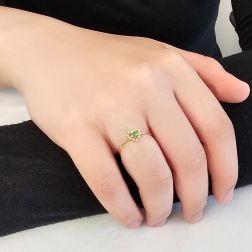 Photo of worn Easy Love Emerald Yellow Gold Solitaire Ring