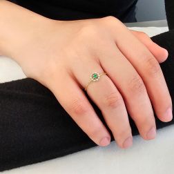 Photo of worn Easy Flower Emerald Yellow Gold Solitaire Ring