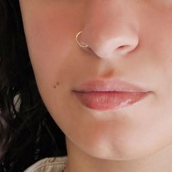 Photo of worn Hoops circles 1cm x 1mm in yellow gold