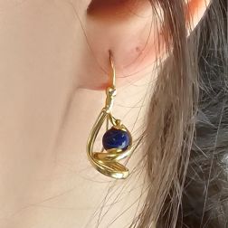photo of worn Yellow Gold Pendants with Blue Lapis Spheres