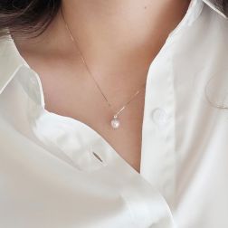 Photo of worn 7mm Akoya Pearl Necklace with a 0.041ct Diamond