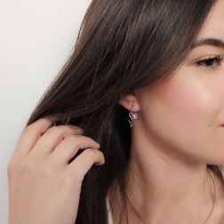 Photo of worn Blossom Wave Flower Earrings with Diamonds