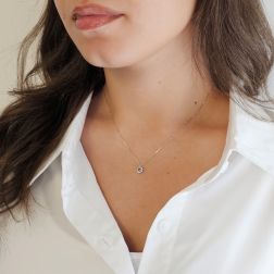 Photo of worn Veneta 0.5mm necklace with aquamarine light point, edged in white gold – 6mm