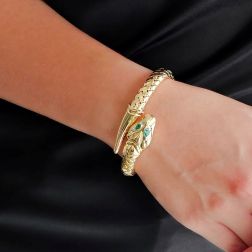 Photo of worn Rigid Snake Bangle bracelet with Emeralds