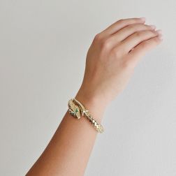 Photo of worn Rigid Snake Bangle bracelet with Emeralds