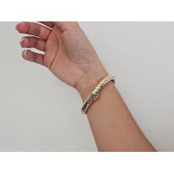 Photo of worn Rigid Snake Bangle bracelet with Emeralds