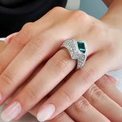 photo of worn Imperial Ring with an Octagonal Emerald and 124 Diamonds