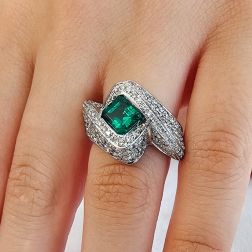 photo of worn Imperial Ring with an Octagonal Emerald and 124 Diamonds
