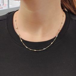 Photo of worn Chain Necklace with Barrels in 18kt Yellow and White Gold