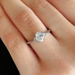 photo of worn Oval Diamond Solitaire Ring 6.7x5mm 0.71ct (GIA) with 2 side Diamonds - Italian Size 14