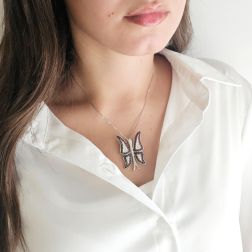 photo of worn White Gold Butterfly Brooch Pendant with Zircons
