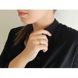 Photo of worn Three-strand Trilogy ring with Diamonds on Yellow Gold
