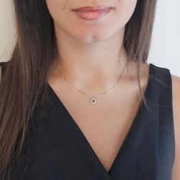 Photo of worn Veneta 0.7mm necklace with rhodolite light point, set in white gold – 7mm