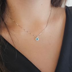 Photo of worn Veneta 0.7mm necklace with a blue Diamond accent set in white gold – 7mm