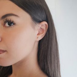 photo of worn Simple Point Light Solitaire Earrings with diamonds weighing 0.08/0.12ct each