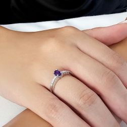 Photo of worn Oval Amethyst Solitaire Ring with 8 Diamonds in White Gold