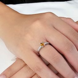 Photo of worn Oval Topaz Solitaire Ring with 8 Diamonds in White Gold