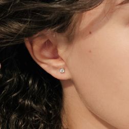 Photo of worn Simple ‘Punto Luce’ Solitaire Earrings with diamonds of 0.14ct each