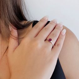 photo fo worn Oval Ruby Solitaire Ring 7x5mm with 2 Diamonds in White Gold