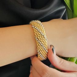 Bracciale Rigido Bollicine bicolor con Diamanti - foto indossata
