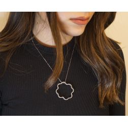 Photo of worn Necklace with stylized Flower and Zircons