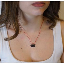 Photo of worn 18kt white gold divisible puzzle pendant