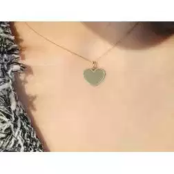 Ciondolo Cuore oro giallo bordo bianco foto indossata