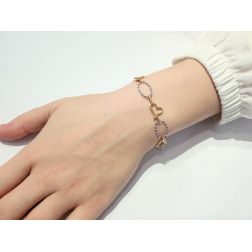 Photo of worn Hearts and Ovals Bracelet in Yellow and White Gold