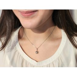 Photo of worn White gold rounded star charm
