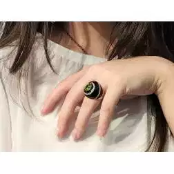 Photo of worn Black Dome Ring Peridot Green Rose Gold