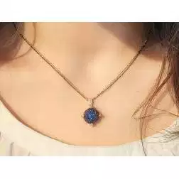 Photo of worn Sphere pendant Necklace with blue and white cubic zirconia