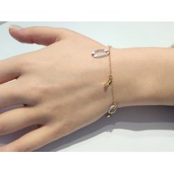 Bracelet with oval charms in yellow and white gold