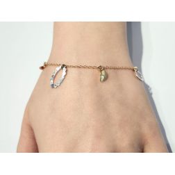 Bracelet with oval charms in yellow and white gold