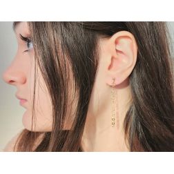 Photo of worn Heart-shaped chain pendant earrings yellow gold
