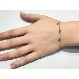 Bracciale con pietre verdi e dischi oro giallo  foto indossata