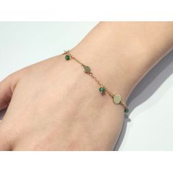 Bracelet with green stones and yellow gold discs