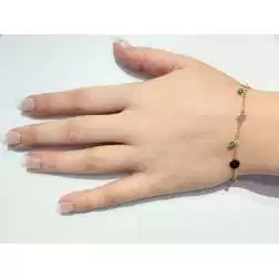 Bracciale con pietre verdi e dischi oro giallo  foto indossata