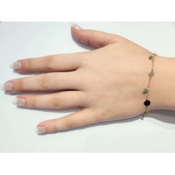 Bracelet with green stones and yellow gold discs