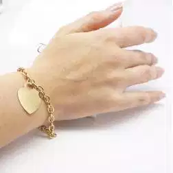 Photo of worn Yellow gold Heart Bracelet