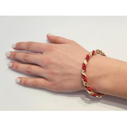 Bracelet with red spheres with yellow gold spiral