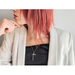 Photo of worn Offset cross in white gold with diamonds
