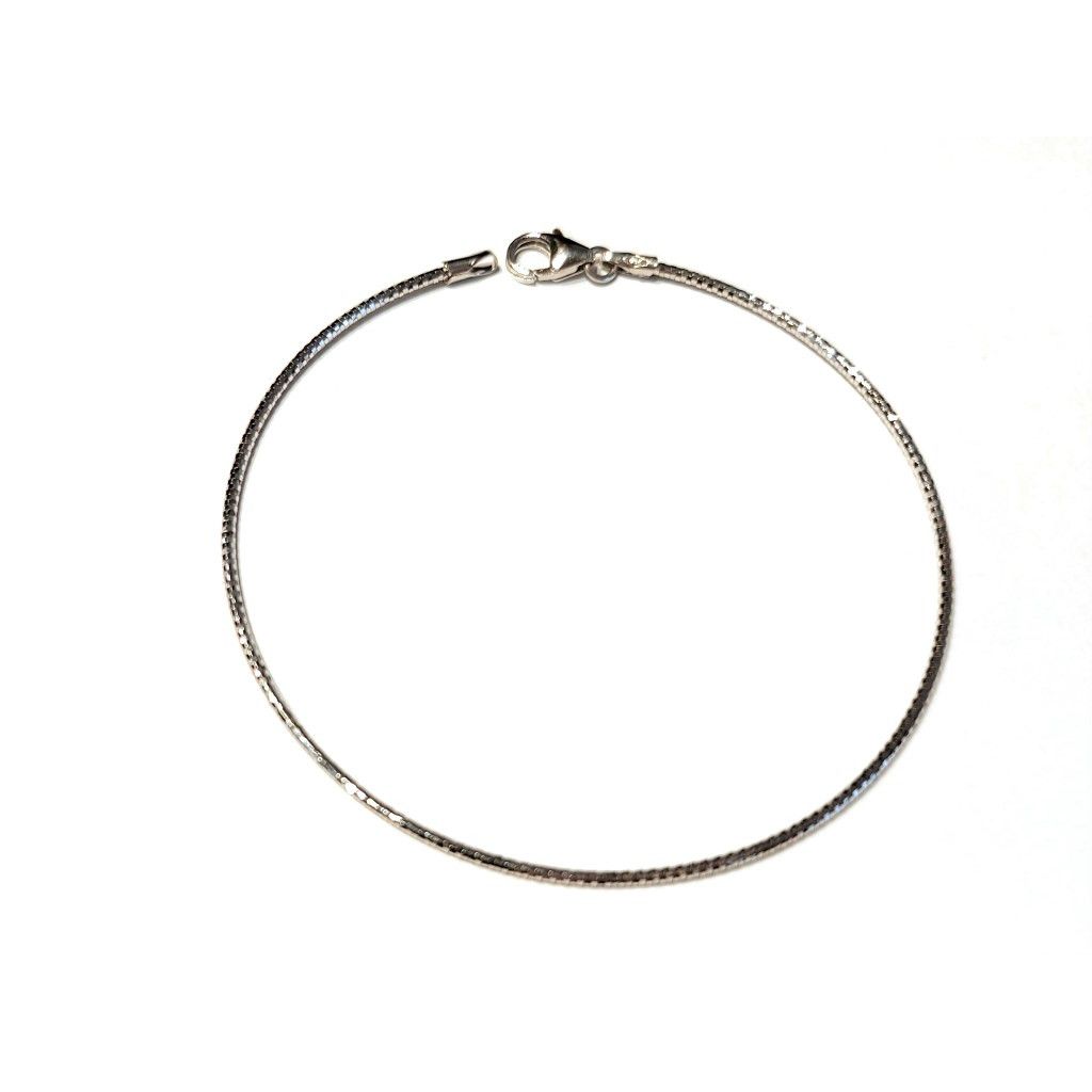 Thin flexible semirigid bracelet in white gold