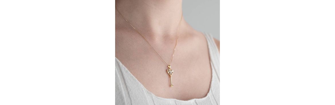 Love pendants in 18kt gold.